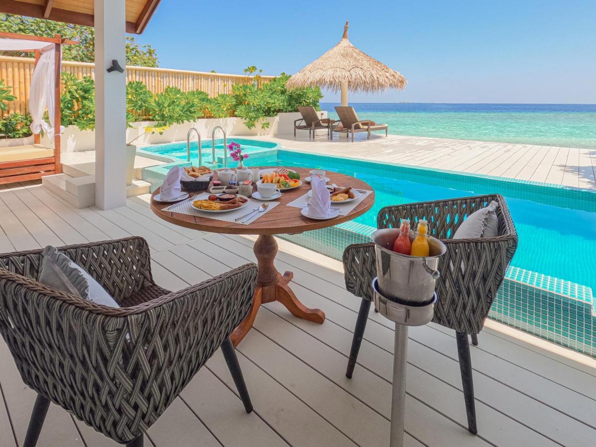 منتجع مالاهيني كودا باندوس هولهومالي المظهر الخارجي الصورة A beach villa at the resort